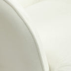 Keinutuoli ja rahi – valkoinen verhoiltu pyökkijalkainen nojatuoli rentoutumiseen